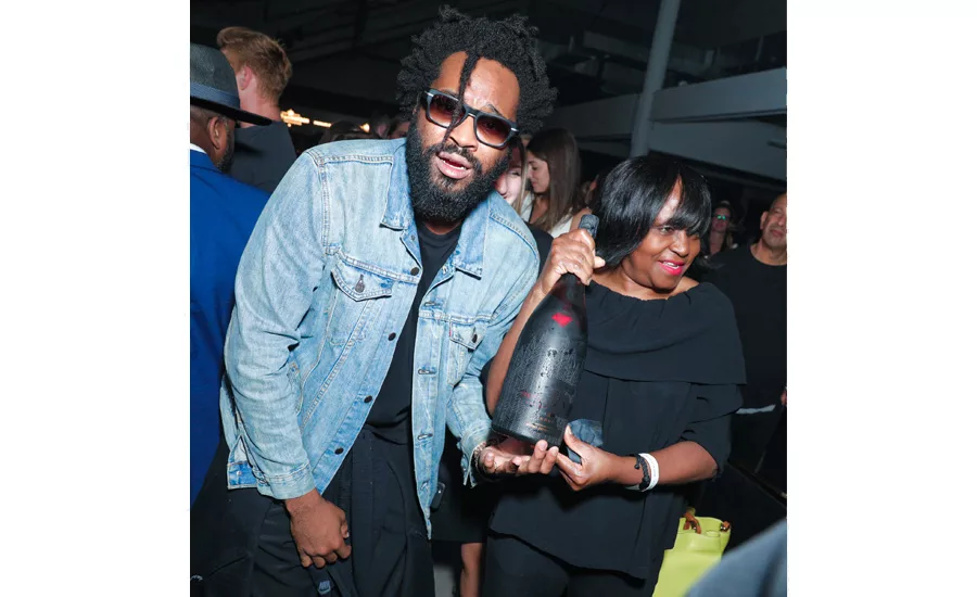 Maxwell Osborne and his mother with the Limited-Edition Moët & Chandon x Public School Bottle