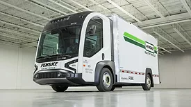 electric truck from ree automotive ltd sitting on a showroom floor