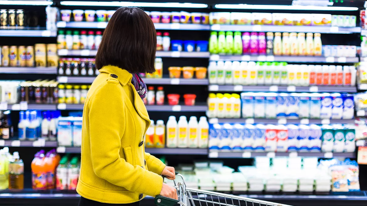 Young woman shopping in the supermarket
