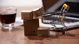 miniature shopping cart and boxes
