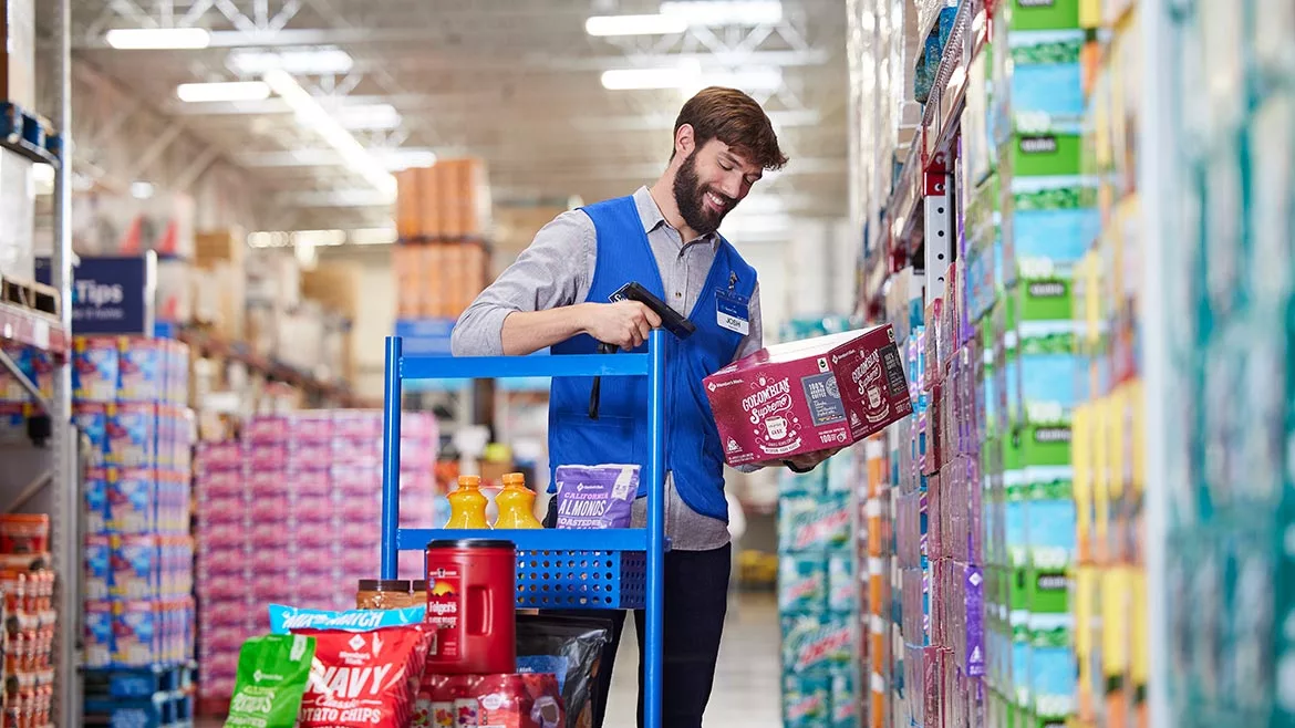 man scanning products at a grocery store