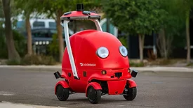 The image shows Dot, an autonomous delivery robot developed by DoorDash.