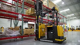 a yellow and black Yale automated lift truck / reach truck