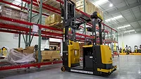 a yellow and black Yale automated lift truck / reach truck