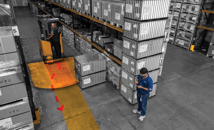 a simulated or computer-generated warehouse scenario highlighting forklift movement and pedestrian safety zones