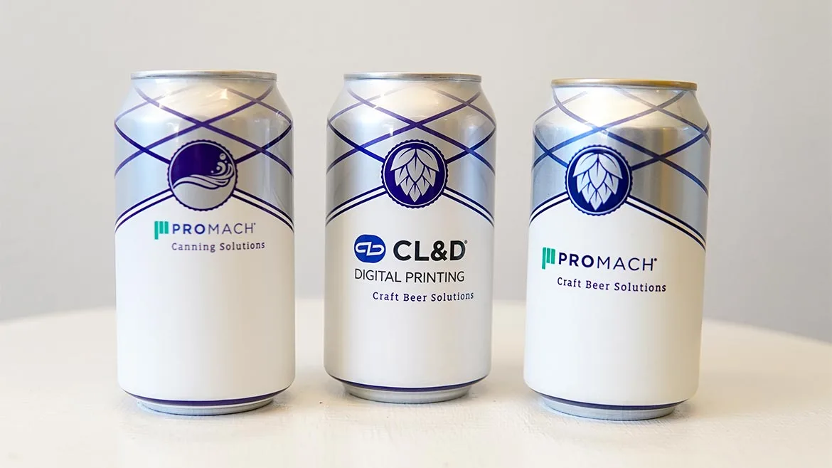 These aluminum beverage cans feature custom shrink sleeve labels manufactured by CL&D, a ProMach brand.