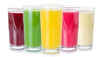 This image displays a collection of colorful fruit juices and smoothies in clear glasses against a white background. 