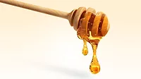 This wooden honey dipper is designed with grooves to hold and drizzle honey without making a sticky mess. 