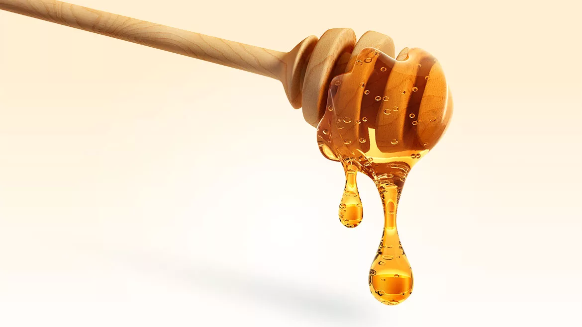 This wooden honey dipper is designed with grooves to hold and drizzle honey without making a sticky mess. 