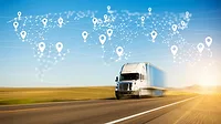 a commercial truck on a highway with a digital map overlay representing global logistics connectivity a commercial truck on a highway with a digital map overlay representing global logistics connectivity
