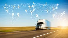 a commercial truck on a highway with a digital map overlay representing global logistics connectivity