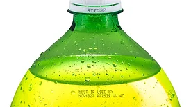 2-liter PET bottle containing a bright yellow beverage, consistent with carbonated soft drinks like Mountain Dew