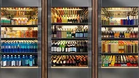 These commercial glass door refrigerators are stocked with a variety of beverages, including sodas and wines. These commercial glass door refrigerators are stocked with a variety of beverages, including sodas and wines.