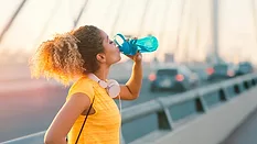  a person staying hydrated while exercising