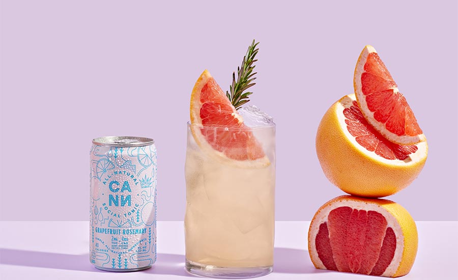 a can and a glass of Cann Grapefruit Rosemary Social Tonic, a microdosed cannabis-infused beverage