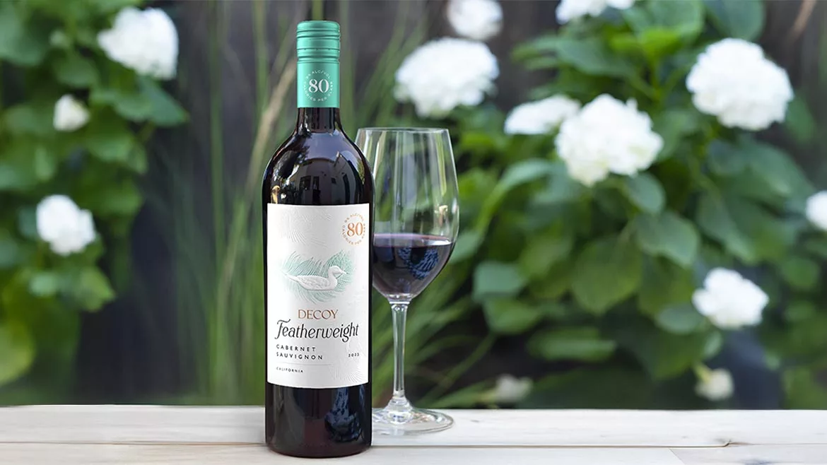 The image features a bottle of Decoy Featherweight Cabernet Sauvignon